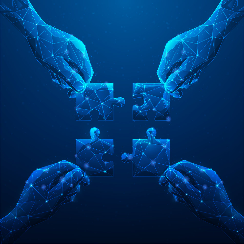 vector image of four hands bringing four puzzle pieces together in various shades of blue